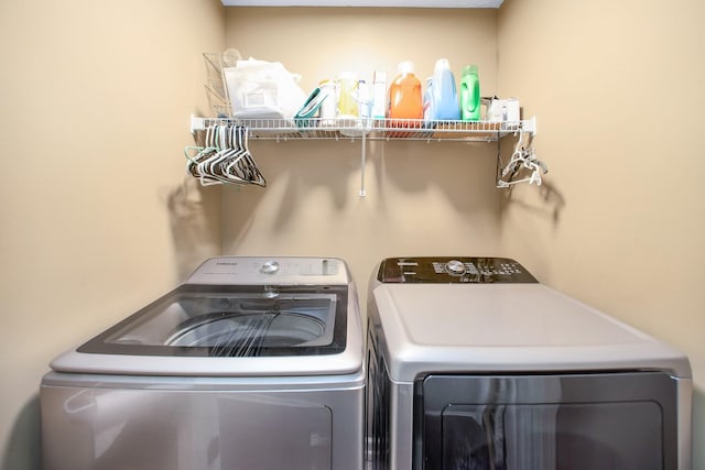 laundry area featuring laundry area and washer and dryer