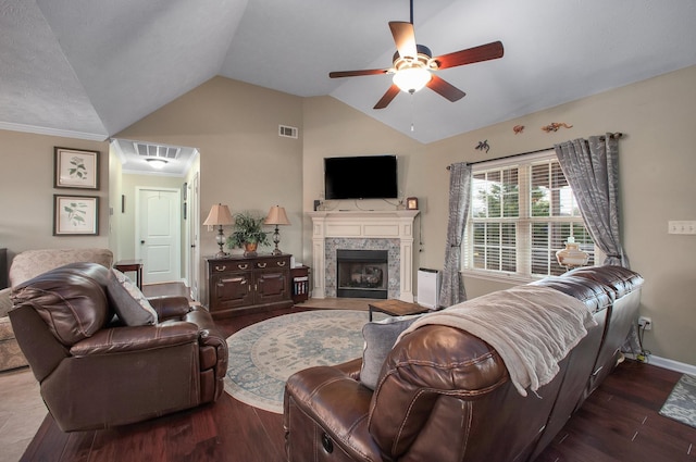 living area with a ceiling fan, wood finished floors, lofted ceiling, and visible vents