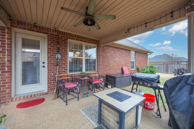 view of patio / terrace with fence, grilling area, and ceiling fan