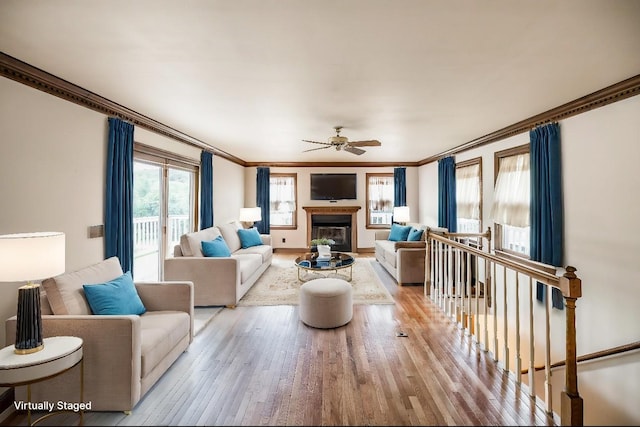 3046 Jenry Dr, Nashville, TN 37214 - living area with ceiling fan, wood finished floors, a glass covered fireplace, and crown molding