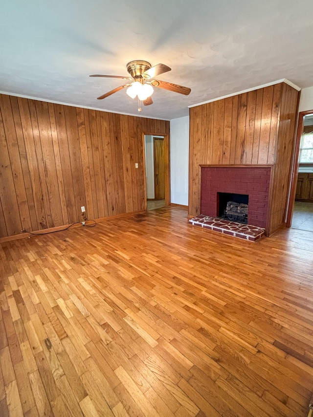 126 Zimmerman St, Hohenwald, TN 38462 - unfurnished living room with a fireplace, ceiling fan, baseboards, and light wood finished floors