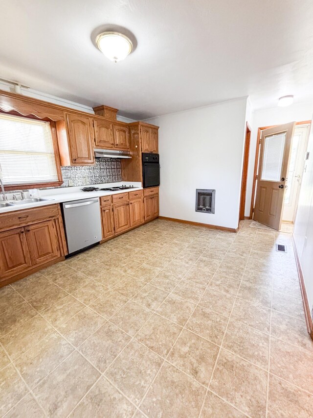 126 Zimmerman St, Hohenwald, TN 38462 - kitchen featuring light countertops, oven, tasteful backsplash, a sink, and stainless steel dishwasher