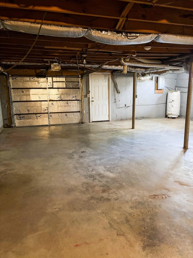126 Zimmerman St, Hohenwald, TN 38462 - garage with water heater and a garage door opener