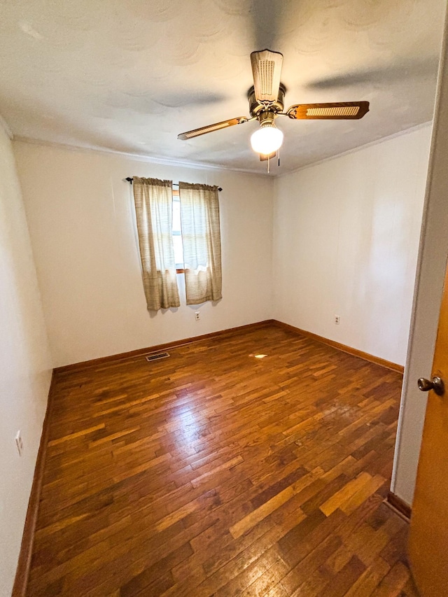 126 Zimmerman St, Hohenwald, TN 38462 - unfurnished room with hardwood / wood-style floors, baseboards, ornamental molding, and visible vents
