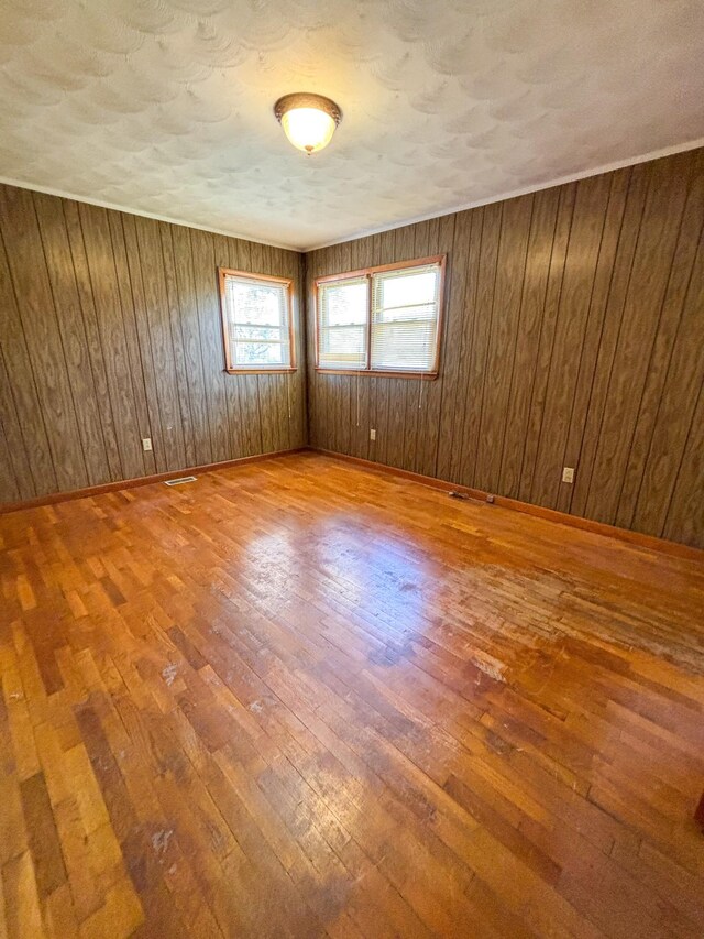 126 Zimmerman St, Hohenwald, TN 38462 - empty room featuring baseboards, visible vents, and wood-type flooring
