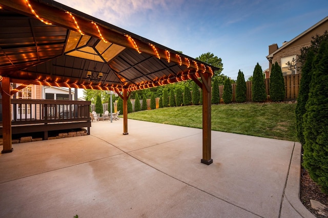 view of patio with a gazebo and fence