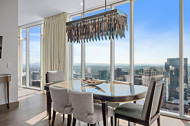 515 Church St Unit 3908, Nashville, TN 37219 - dining space with plenty of natural light, floor to ceiling windows, wood finished floors, and a city view
