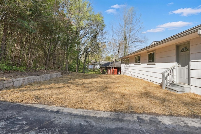 view of yard with entry steps