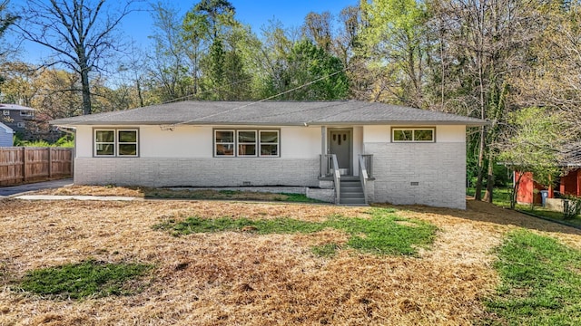 single story home featuring fence, stucco siding, and stone siding