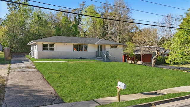 821 S Germantown Rd, Chattanooga, TN 37412 - ranch-style home featuring a front lawn, concrete driveway, brick siding, and stucco siding