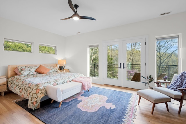 1122 Oman Dr, Brentwood, TN 37027 - bedroom featuring wood finished floors, access to outside, and multiple windows