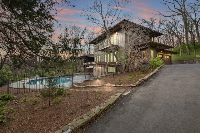 1122 Oman Dr, Brentwood, TN 37027 - property exterior at dusk featuring fence and a garage
