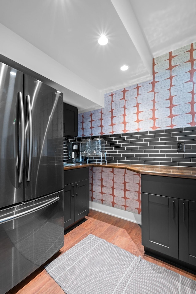 1122 Oman Dr, Brentwood, TN 37027 - kitchen with freestanding refrigerator, decorative backsplash, light wood-style flooring, dark cabinets, and recessed lighting