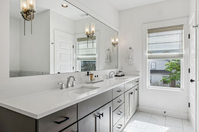 1547 Battlefield Dr, Nashville, TN 37215 - bathroom with marble finish floor, double vanity, baseboards, and a sink