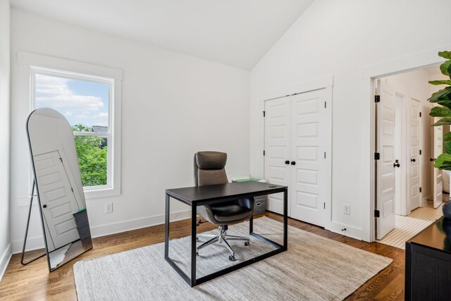 1547 Battlefield Dr, Nashville, TN 37215 - home office with baseboards, lofted ceiling, and wood finished floors