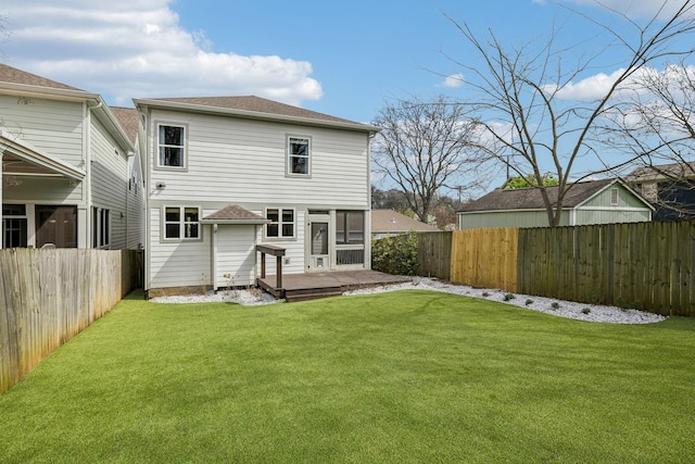 1547 Battlefield Dr, Nashville, TN 37215 - back of property with a wooden deck, a fenced backyard, and a lawn