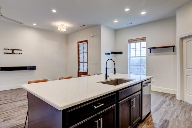 1006 Chisolm Trl, Goodlettsville, TN 37072 - kitchen featuring recessed lighting, baseboards, stainless steel dishwasher, a sink, and light wood finished floors
