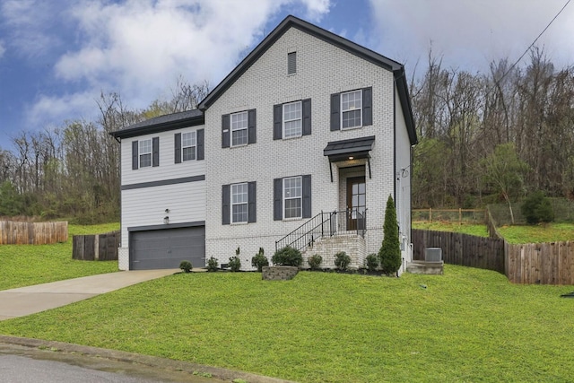 1006 Chisolm Trl, Goodlettsville, TN 37072 - view of front of property featuring fence, a garage, concrete driveway, a front yard, and brick siding