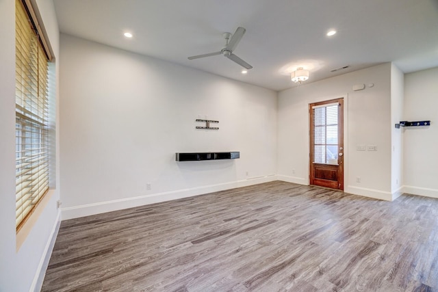 1006 Chisolm Trl, Goodlettsville, TN 37072 - unfurnished living room with baseboards, wood finished floors, recessed lighting, and a ceiling fan