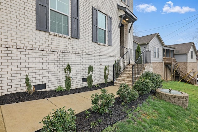 1006 Chisolm Trl, Goodlettsville, TN 37072 - view of side of property featuring crawl space, brick siding, and a lawn