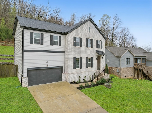 1006 Chisolm Trl, Goodlettsville, TN 37072 - view of front facade with concrete driveway, fence, a front lawn, brick siding, and a garage