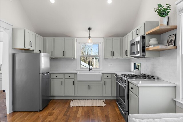 920A Kirkwood Ave, Nashville, TN 37204 - kitchen featuring a sink, vaulted ceiling, stainless steel appliances, and open shelves