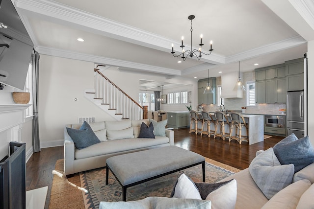 920A Kirkwood Ave, Nashville, TN 37204 - living room featuring dark wood-style flooring, a notable chandelier, crown molding, and visible vents