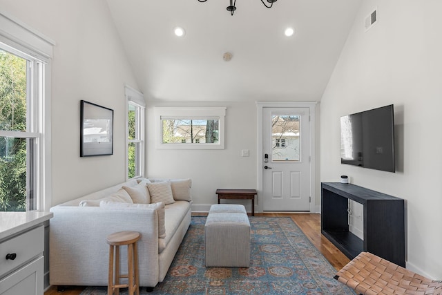 920A Kirkwood Ave, Nashville, TN 37204 - living room featuring a wealth of natural light, visible vents, vaulted ceiling, and wood finished floors