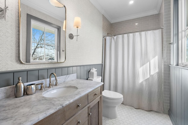 920A Kirkwood Ave, Nashville, TN 37204 - bathroom featuring wallpapered walls, a wealth of natural light, ornamental molding, and wainscoting
