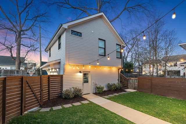 920A Kirkwood Ave, Nashville, TN 37204 - back of property at dusk with fence and a yard
