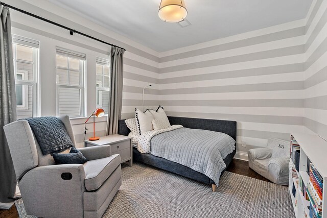920A Kirkwood Ave, Nashville, TN 37204 - bedroom featuring baseboards, wood finished floors, and wallpapered walls