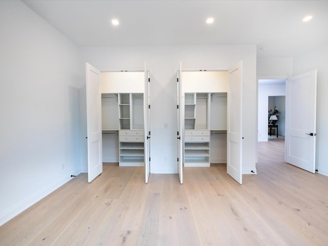 3848 Granny White Pike, Nashville, TN 37204 - unfurnished bedroom featuring two closets, baseboards, light wood-style flooring, and recessed lighting