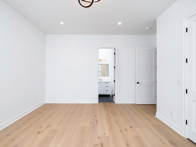3848 Granny White Pike, Nashville, TN 37204 - unfurnished bedroom with light wood-style floors, baseboards, ensuite bath, and recessed lighting