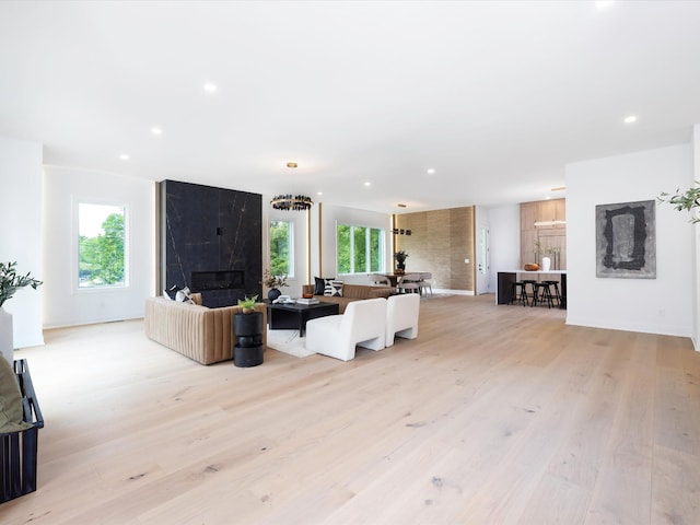 3848 Granny White Pike, Nashville, TN 37204 - living area featuring light wood finished floors, a premium fireplace, recessed lighting, and baseboards