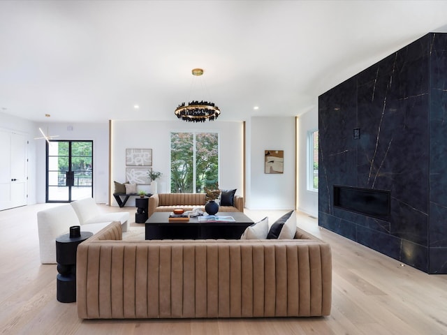 3848 Granny White Pike, Nashville, TN 37204 - living room featuring wood finished floors, a fireplace, recessed lighting, and a chandelier