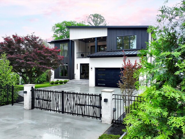 3848 Granny White Pike, Nashville, TN 37204 - contemporary home with a fenced front yard, a balcony, a standing seam roof, a gate, and metal roof