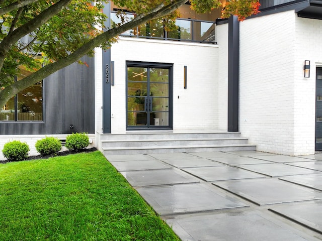 3848 Granny White Pike, Nashville, TN 37204 - doorway to property with brick siding and a lawn