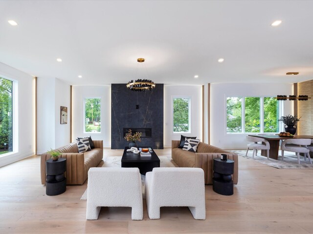 3848 Granny White Pike, Nashville, TN 37204 - living area with plenty of natural light, light wood-style floors, a fireplace, and recessed lighting