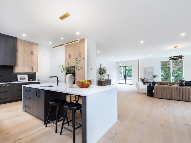 3848 Granny White Pike, Nashville, TN 37204 - kitchen with modern cabinets, light brown cabinetry, recessed lighting, light countertops, and a sink