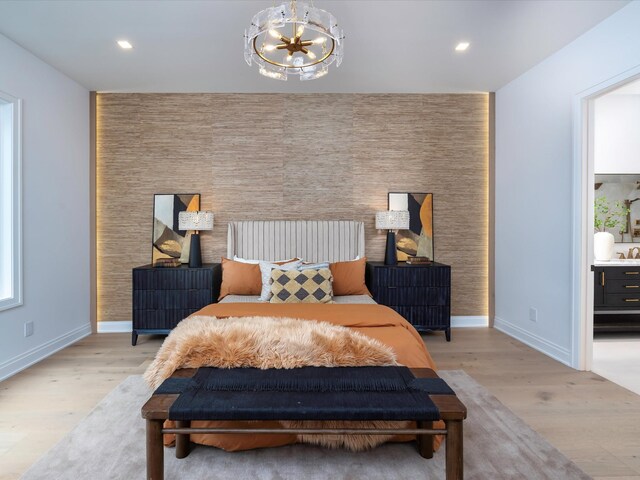 3848 Granny White Pike, Nashville, TN 37204 - bedroom with a chandelier, light wood-style flooring, baseboards, recessed lighting, and an accent wall