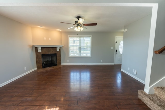 532 Falkland Cir, Clarksville, TN 37042 - unfurnished living room with baseboards, dark wood-type flooring, stairway, and ceiling fan