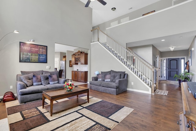 133 Grove Ln S, Hendersonville, TN 37075 - living room with baseboards, a high ceiling, a ceiling fan, stairway, and wood finished floors