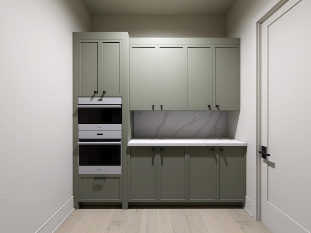 825B Kirkwood Ave, Nashville, TN 37204 - interior space with light countertops, gray cabinetry, light wood-style floors, and white double oven