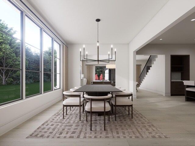 825B Kirkwood Ave, Nashville, TN 37204 - dining space with light wood-style flooring, stairway, and a notable chandelier