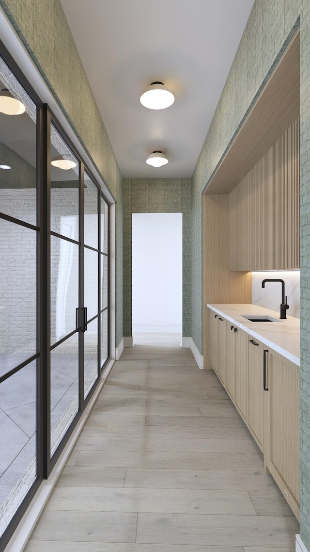 825B Kirkwood Ave, Nashville, TN 37204 - hallway featuring light wood-type flooring, a sink, and baseboards