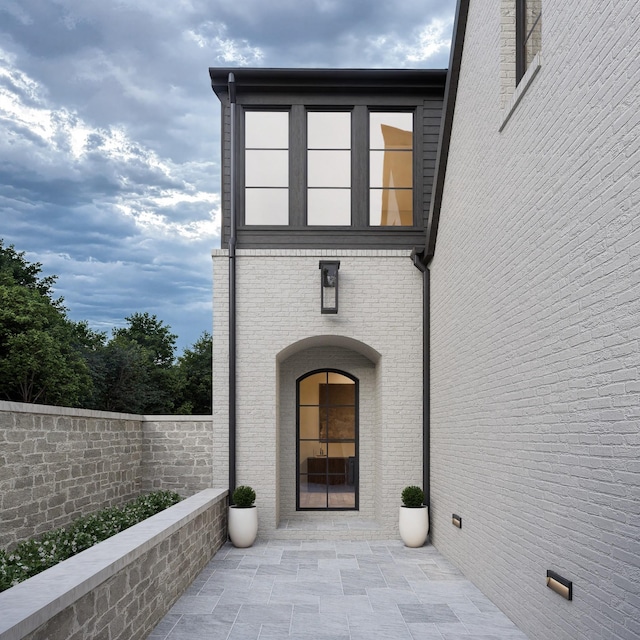 825B Kirkwood Ave, Nashville, TN 37204 - doorway to property with brick siding, fence, and a patio