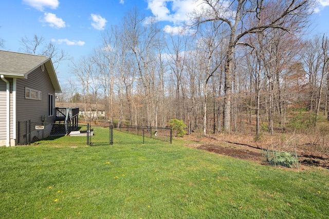 view of yard with fence and a gate
