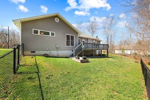 rear view of property with a deck, a yard, crawl space, a fenced backyard, and stairs