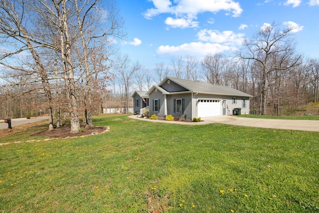view of side of home with roof with shingles, a yard, a garage, and driveway