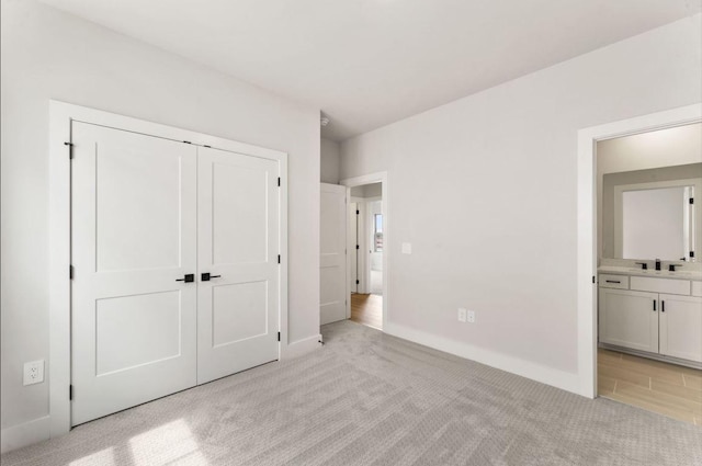 2615 Wilkinson Pike Unit 7A, Murfreesboro, TN 37129 - unfurnished bedroom with light carpet, connected bathroom, and a closet